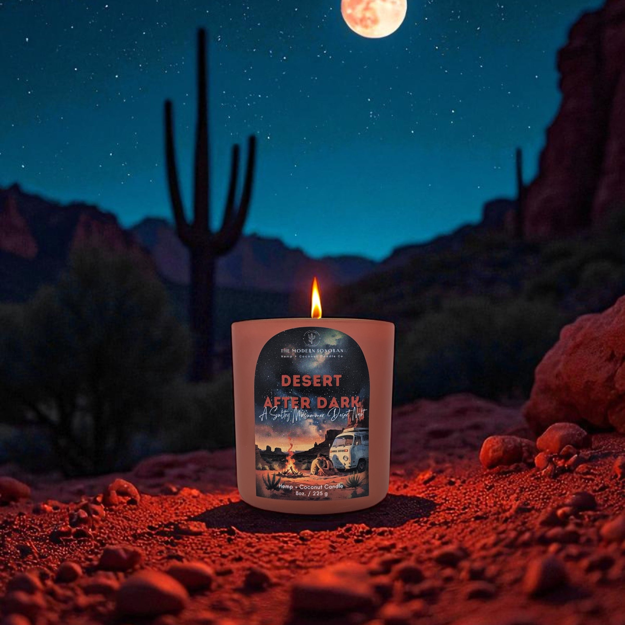 Candle with a desert scene label on a rocky surface under a full moon. Clean non toxic candle labeled 'Desert After Dark'. Best Arizona high desert boho western decor.