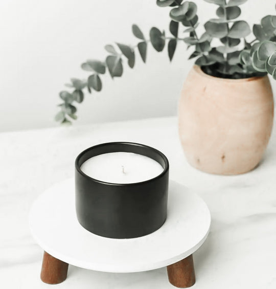 Porch Swing Hemp and Coconut wax candles. Smells like Iced Tea and Thyme. One of the candles from our modern farmhouse collection, This Iced tea and thyme scented clean ingredient, non-toxic candle is soy free, paraffin free, carcinogen free, mutagen free, and contain no hormone disruptors. Sustainably sourced ingredients. In a 5 oz. black Ceramic jar with bamboo lid. Single jar candle with the lid removed is pictured.