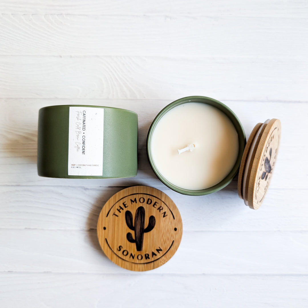 Caffeinated & Confident Coffee scented Hemp and Coconut wax candle. One of the candles from our modern farmhouse collection, this Cold Brew Coffee scented clean ingredient, non-toxic candle is soy free, paraffin free, carcinogen free, mutagen free, and contain no hormone disruptors. Sustainably sourced ingredients. In a 5 oz. sage green Ceramic jar with bamboo lids. best Farmhouse Decor & best Farmhouse gifts.