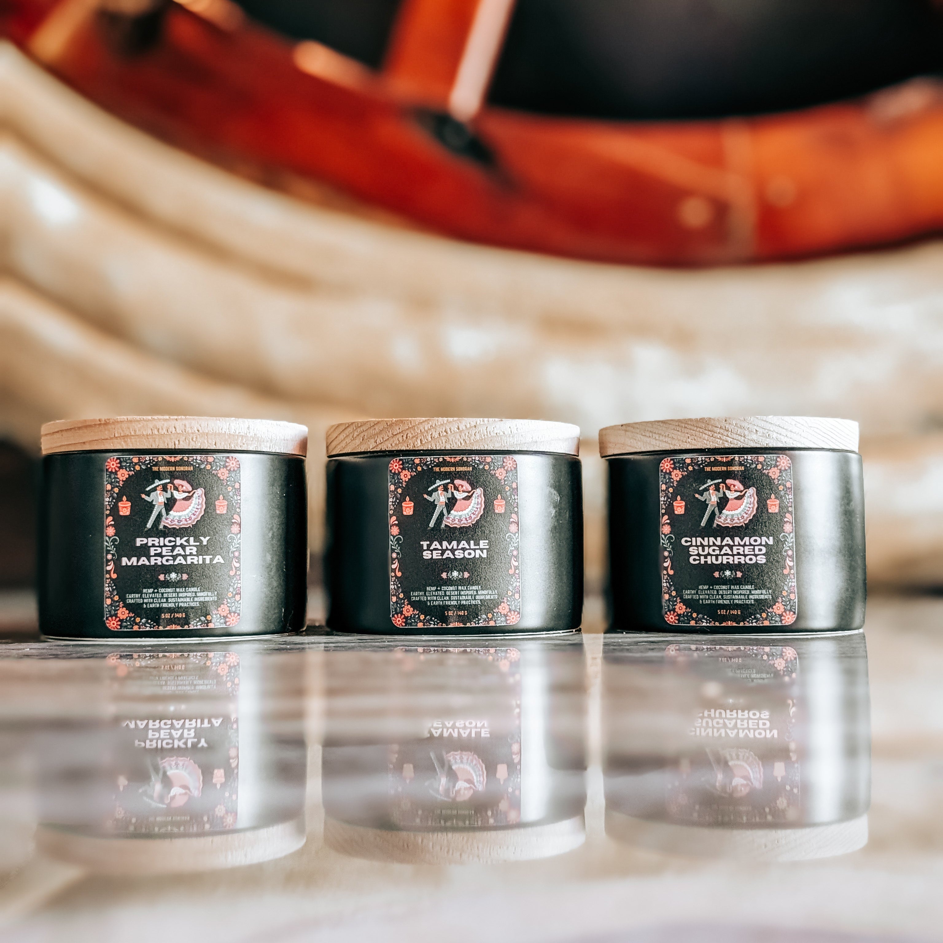 a picture of The southwestern Fiesta Candle Collection - a celebration of hispanic cultural influence on the United States Southwest. 3 festive, lively scented candles inspired by arizona living: prickly pear margarita, tamale season, and cinnamon sugared churros complete this southwestern candle collection. Mindfully crafted with clean, sustainable ingredients & earth friendly practices. Earthy, yet elevated candles for modern southwestern living.