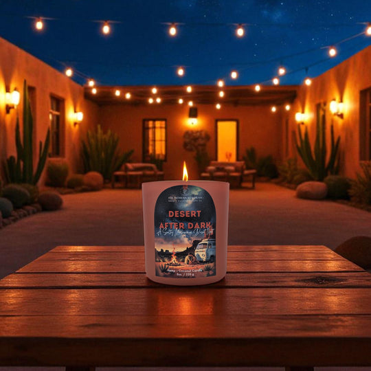Arizona candle labeled 'Desert After Dark' on a wooden table with a nighttime outdoor setting.