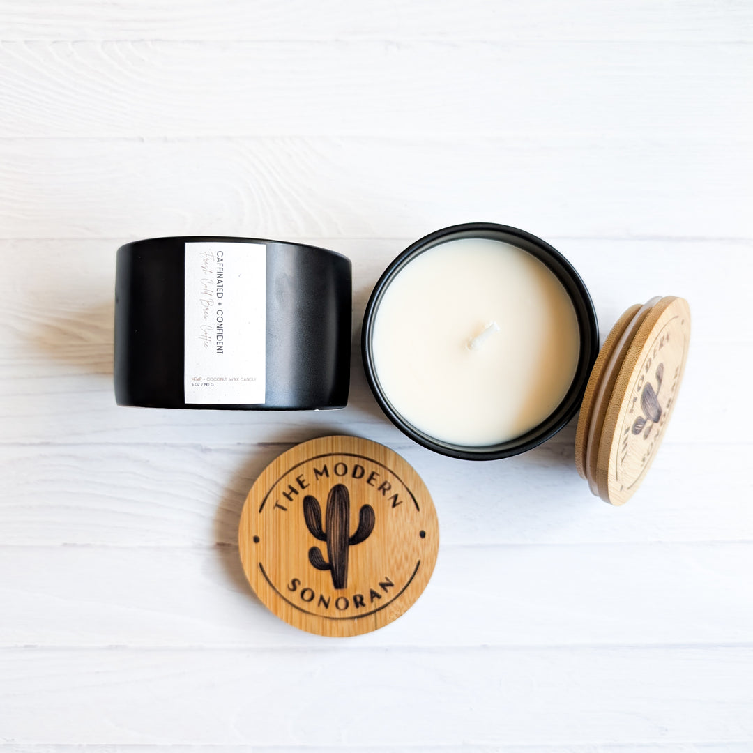 Caffeinated & Confident Coffee scented Hemp and Coconut wax candle. One of the candles from our modern farmhouse collection, this Cold Brew Coffee scented clean ingredient, non-toxic candle is soy free, paraffin free, carcinogen free, mutagen free, and contain no hormone disruptors. Sustainably sourced ingredients. In a 5 oz. black Ceramic jar with bamboo lids. best Farmhouse Decor & best Farmhouse gifts. Made in Arizona, USA.